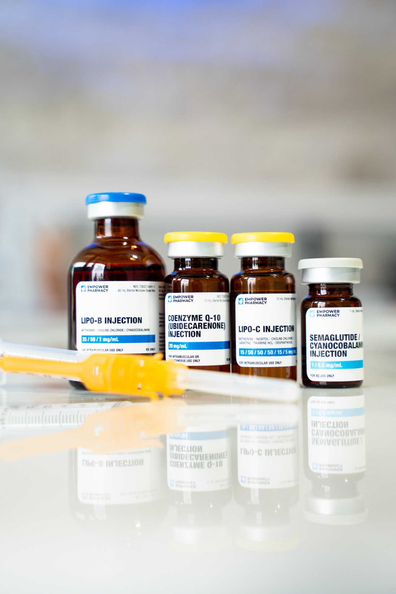 Our IM Shot Menu — Lipo Slim · CoQ10 · Biotin · B12 — pharmacy-grade vials