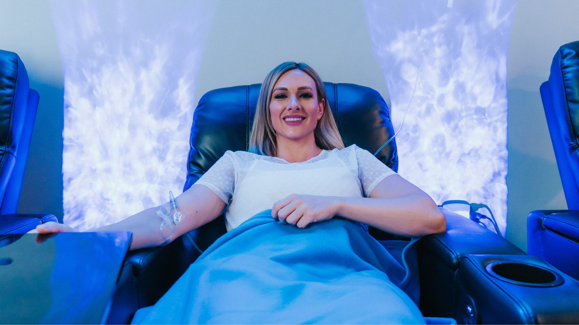 Patient receiving IV infusion therapy for hydration and vitamin delivery